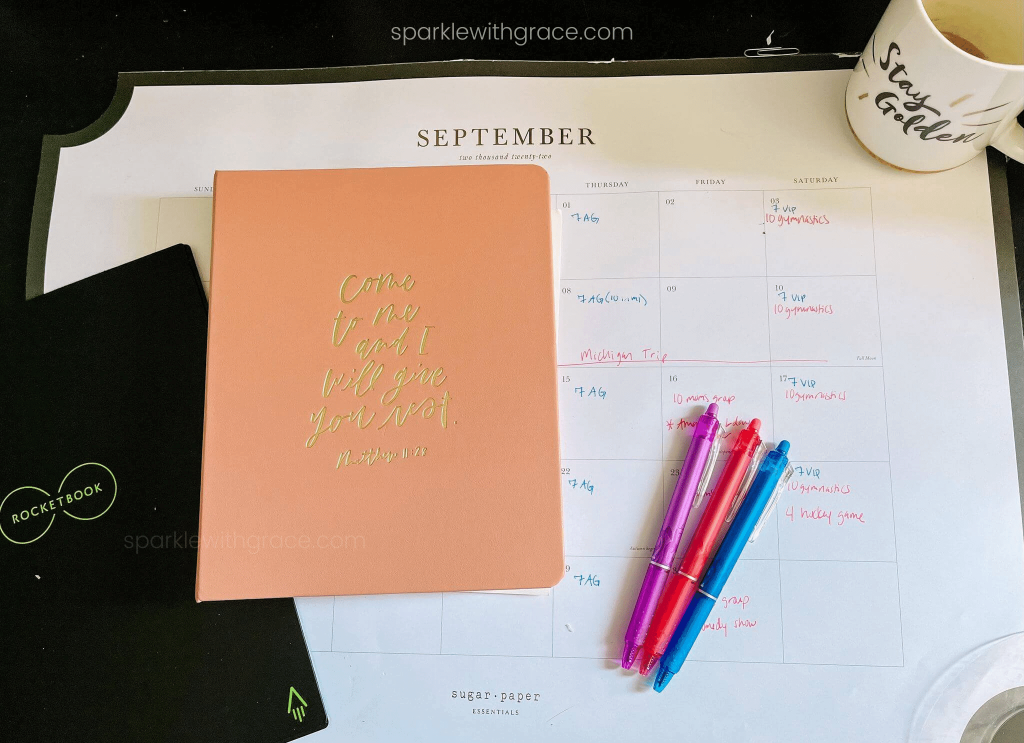 desktop with calendar, planner, and rocketbook notebook